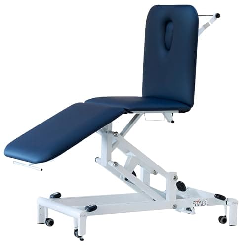 Table de traitement STABIL Komfort à trois sections, sellerie bleu marine, dossier relevé avec trou visage, châssis blanc à bras articulés sur roulettes