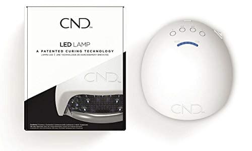Lampe LED CND blanche et grise à touches de programme sur le dessus, ouverture frontale pour la main
