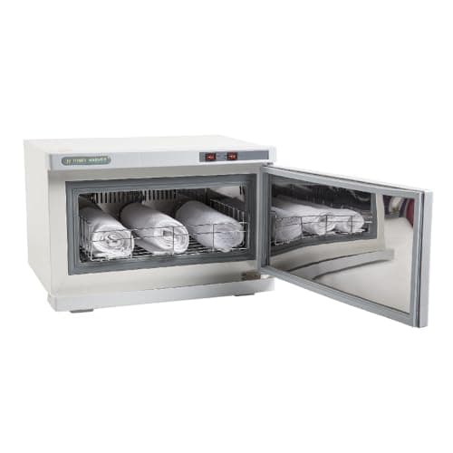 Armoire chauffe-serviettes blanche porte ouverte, une grille chargée de serviettes roulées, intérieur en métal brossé